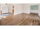 Bright, airy living room features hardwood floors and fresh neutral paint throughout the home at 3828 Chandworth Rd, Charlotte, NC 28210