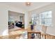 Home office with natural light, hardwood floors, modern decor, and a view to the living room at 3828 Chandworth Rd, Charlotte, NC 28210
