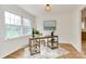Bright office space with large windows, area rug and modern furnishings at 3828 Chandworth Rd, Charlotte, NC 28210