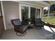 Comfortable porch with swivel chairs offers a perfect spot to unwind and enjoy peaceful outdoor views, and fresh air at 3828 Chandworth Rd, Charlotte, NC 28210