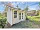 This backyard shed features double doors and two windows, offering ample storage and potential for a workshop at 3828 Chandworth Rd, Charlotte, NC 28210