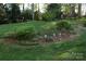 Beautiful yard with lush greenery and flowerbeds at 3828 Chandworth Rd, Charlotte, NC 28210