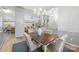 Bright dining room with chandelier and hardwood floors at 3903 Bon Rea Dr, Charlotte, NC 28226