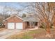 Brick ranch home with two-car garage and landscaped yard at 3903 Bon Rea Dr, Charlotte, NC 28226