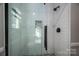 Clean bathroom with white subway tile and a glass shower door at 401 Kenwood Ave, Cherryville, NC 28021