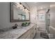 Elegant bathroom with granite double vanity and a walk-in shower at 401 Kenwood Ave, Cherryville, NC 28021