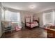 Cozy bedroom with a full-size bed and plenty of natural light at 401 Kenwood Ave, Cherryville, NC 28021