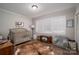 Charming bedroom with a crib and plenty of storage at 401 Kenwood Ave, Cherryville, NC 28021