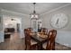 Dining room with dark wood table and large clock at 401 Kenwood Ave, Cherryville, NC 28021