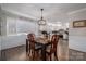 Cozy dining area adjacent to kitchen with farmhouse decor at 401 Kenwood Ave, Cherryville, NC 28021