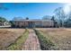 Brick ranch house with walkway and landscaping at 401 Kenwood Ave, Cherryville, NC 28021