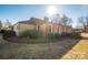 Side view of brick ranch house with landscaping at 401 Kenwood Ave, Cherryville, NC 28021