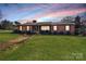 Charming brick home with a manicured lawn and inviting entrance, perfect for a cozy Gathering lifestyle at 401 Kenwood Ave, Cherryville, NC 28021