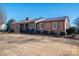 Front view of brick ranch house with yard at 401 Kenwood Ave, Cherryville, NC 28021