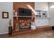 Brick fireplace with decorative fire screen and mantle at 401 Kenwood Ave, Cherryville, NC 28021