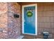 Blue front door with a welcome wreath at 401 Kenwood Ave, Cherryville, NC 28021