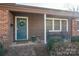 Inviting front porch with blue door and rocking chairs at 401 Kenwood Ave, Cherryville, NC 28021