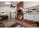 Spacious living room with a brick fireplace and built-in shelving at 401 Kenwood Ave, Cherryville, NC 28021