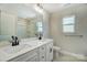 Double vanity bathroom with a window and shower at 5036 Heathland Dr # 71, Charlotte, NC 28215