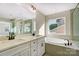 Bathroom boasts double sinks, a large soaking tub and shower at 5036 Heathland Dr # 71, Charlotte, NC 28215