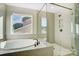 Spa-like bathroom with a soaking tub and a walk-in shower at 5036 Heathland Dr # 71, Charlotte, NC 28215