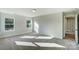 Spacious bedroom with carpet, large windows, and sunlit interior at 5036 Heathland Dr # 71, Charlotte, NC 28215