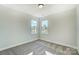 Cozy bedroom featuring carpet and ample natural light at 5036 Heathland Dr # 71, Charlotte, NC 28215