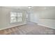 Bright loft area with carpet and large windows at 5036 Heathland Dr # 71, Charlotte, NC 28215