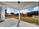 Covered patio overlooking backyard and new construction at 5036 Heathland Dr # 71, Charlotte, NC 28215