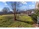 Spacious backyard with grassy lawn, wooden fence, and pergola-covered patio at 505 Viking Sw Dr, Concord, NC 28025