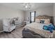 Bedroom with a gray upholstered bed and a gray chair at 505 Viking Sw Dr, Concord, NC 28025