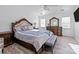 Bright bedroom with a king-size bed, large dresser, and ceiling fan at 505 Viking Sw Dr, Concord, NC 28025