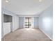 Spacious bedroom with ample closet space and access to a balcony at 5190 Corbin Ln, Hickory, NC 28601