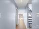 Light-filled hallway with wood floors, leading to stairs and lake view at 5190 Corbin Ln, Hickory, NC 28601