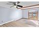 Bright living room with hardwood floors, exposed beams, and access to a lake view at 5190 Corbin Ln, Hickory, NC 28601