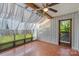 Bright sunroom featuring tile floors, exposed beams, and lots of natural light at 5190 Corbin Ln, Hickory, NC 28601
