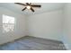 Simple bedroom with wood-look floors and a window at 5966 Quarter Mile Rd # 2, Clover, SC 29710