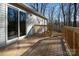 Wooden deck and sliding glass doors leading to backyard at 5966 Quarter Mile Rd # 2, Clover, SC 29710