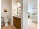 Powder room with a modern vanity and decorative mirror at 604 N Providence St, Waxhaw, NC 28173