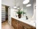 Double vanity bathroom with wood cabinets and quartz countertops at 604 N Providence St, Waxhaw, NC 28173