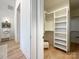 White built-in shelving in a spacious closet at 604 N Providence St, Waxhaw, NC 28173