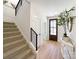 Light-filled entryway with hardwood floors and a wooden door at 604 N Providence St, Waxhaw, NC 28173