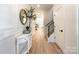 Bright entryway with hardwood floors, white walls, and a half-wall at 604 N Providence St, Waxhaw, NC 28173