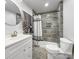 Modern bathroom with tiled shower, sleek vanity, and stylish fixtures at 630 N Moran St, Gastonia, NC 28052