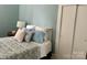 Cozy bedroom with a queen-size bed and built-in shelving at 6963 Kershaw Camden Hwy, Kershaw, SC 29067