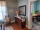 Bedroom with dresser, chair, and view of home office at 6963 Kershaw Camden Hwy, Kershaw, SC 29067