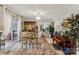 Spacious dining room with glass table, artwork, and access to a balcony at 7513 Mariner Cove Dr, Cornelius, NC 28031