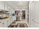 Well-equipped kitchen with light cabinets and tile backsplash at 7513 Mariner Cove Dr, Cornelius, NC 28031