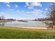 Waterfront view with sandy beach and boat docks at 7513 Mariner Cove Dr, Cornelius, NC 28031