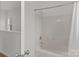 Simple bathroom with shower/tub combo and a window at 7620 Rolling Meadows Ln, Huntersville, NC 28078